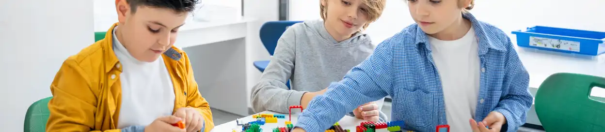 School kids building a lego set