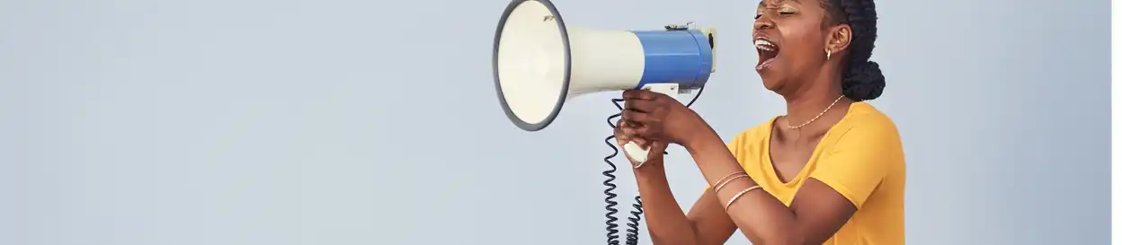 A teacher shouts into a megaphone