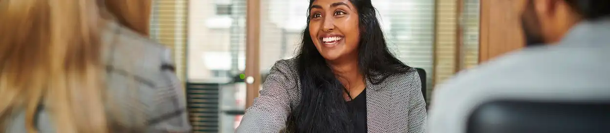 A smiling woman at a job interview