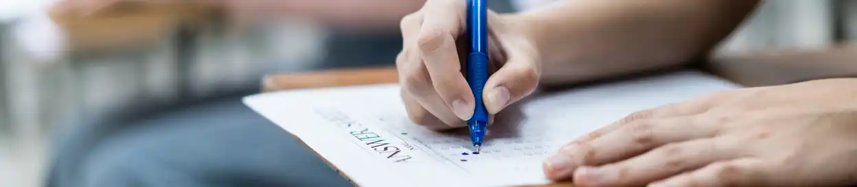 A student writing on a test