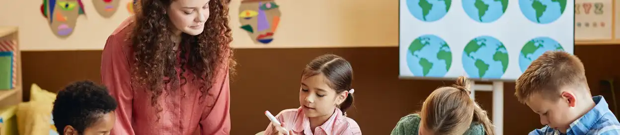 An engaged classroom of kids making posters