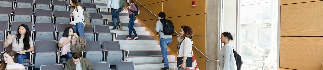 Students find seats in a lecture hall