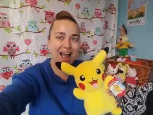 Online TEFL teacher Lindsay holding up a toy pikachu 