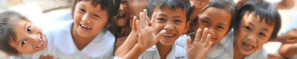 Schoolchildren laughing and smiling