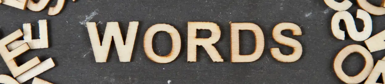 wooden letters on a board, spelling the word 'WORDS'