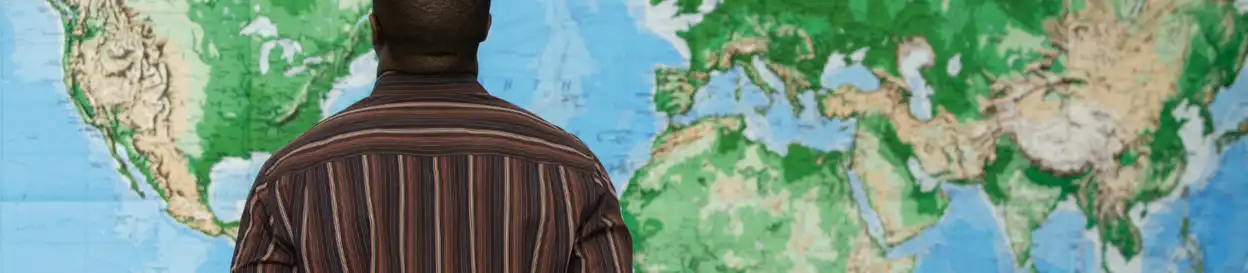 Someone looking at a world map