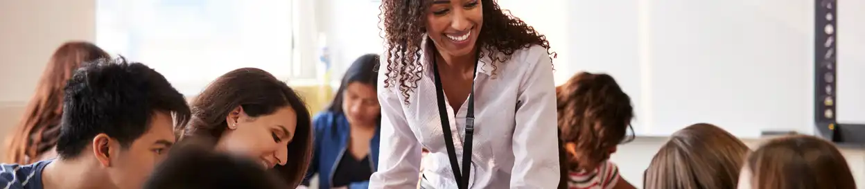 a TEFL teacher works with her class