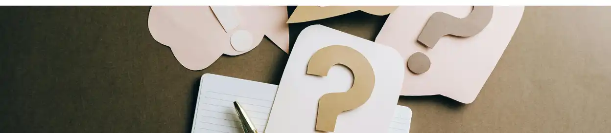 Cards with question marks laying on a surface