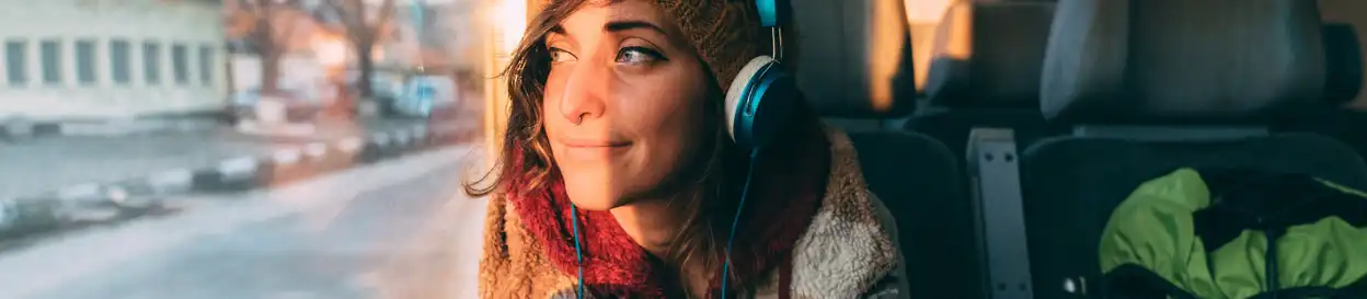A girl on a train, looking out the window