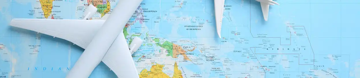 A map of Oceania, with two toy aeroplanes