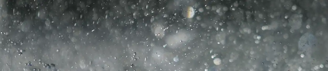 Rainfall against a grey backdrop