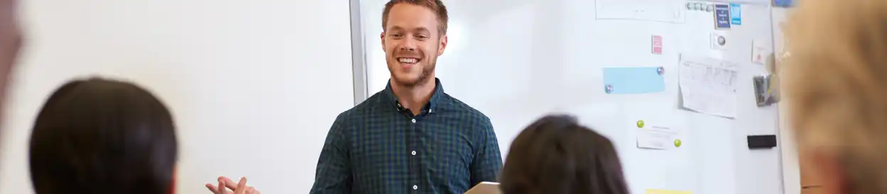 A teacher addresses students