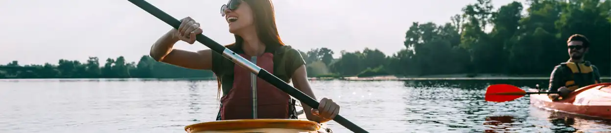 Two people canoeing on a lake