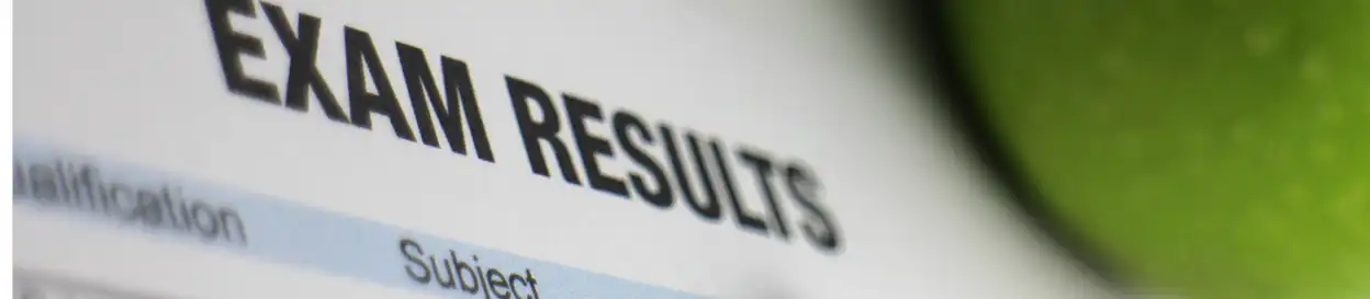 A sheet that says "EXAM RESULTS"