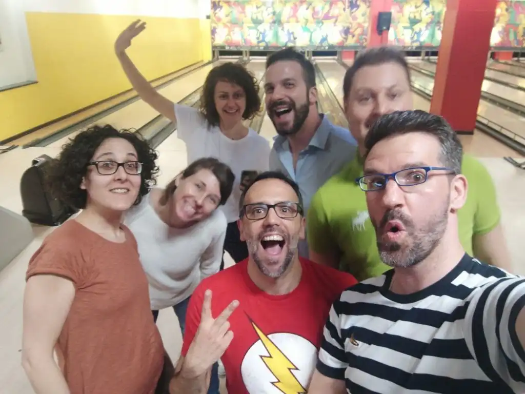 Seth with friends in Italy at a bowling alley