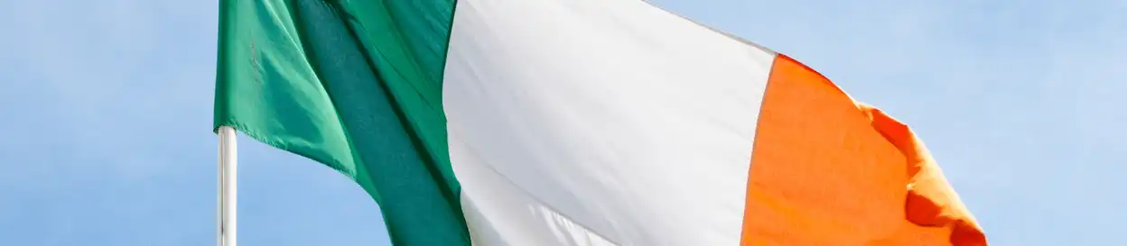 The irish flag flying from a mast