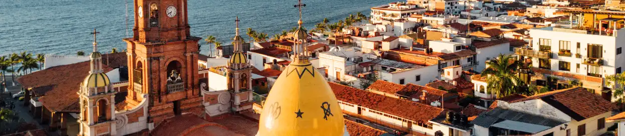 A coastal town in Mexico with red bricked rooftops