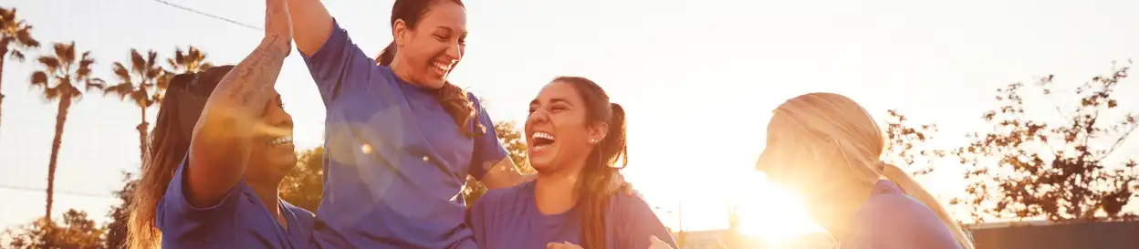 female football players celebrating 