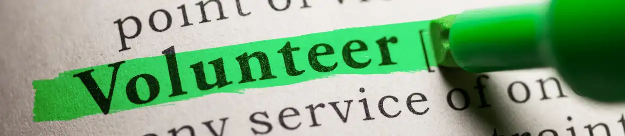 The word 'volunteer' highlighted in green highlighter