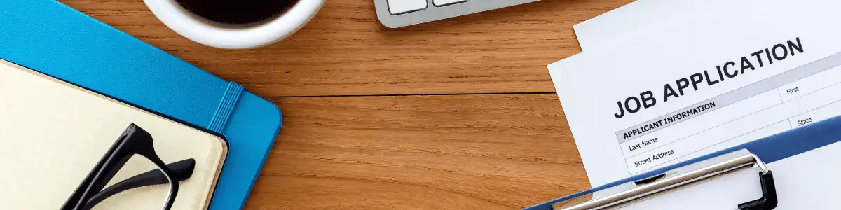 Desk with a job application on it