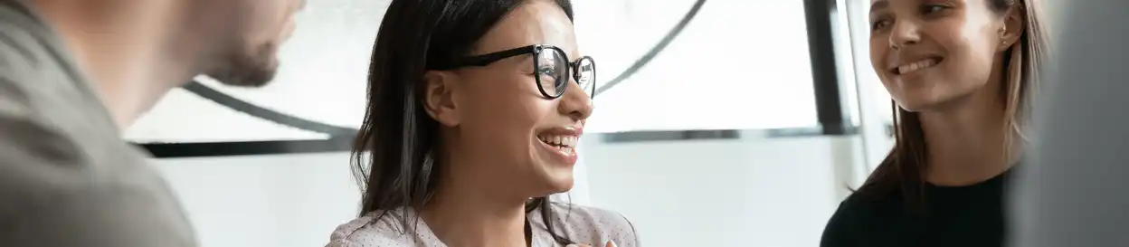 A woman with glasses talking