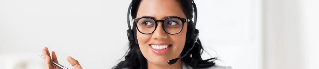 A woman wearing a headset teaching online