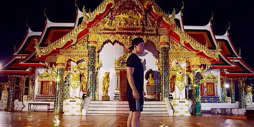 James standing in front of a temple in Thailand
